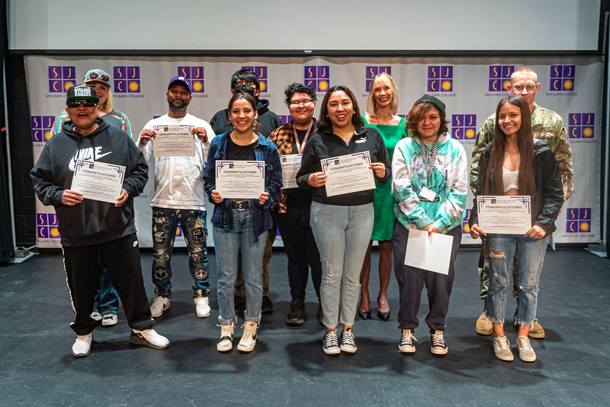 Group of students at the NC3 Signing Day holding up their certificates.