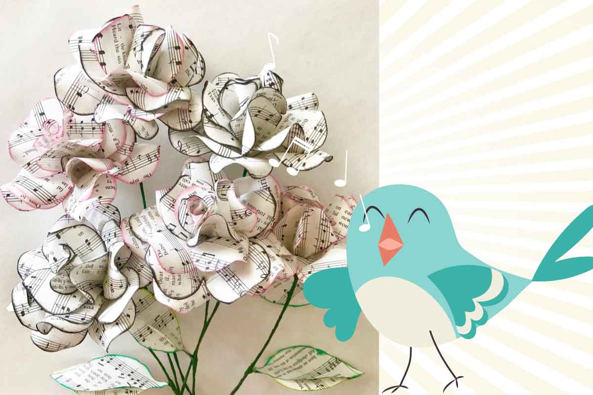 A cluster of flowers made from music paper with a cartoon blue bird to the right.