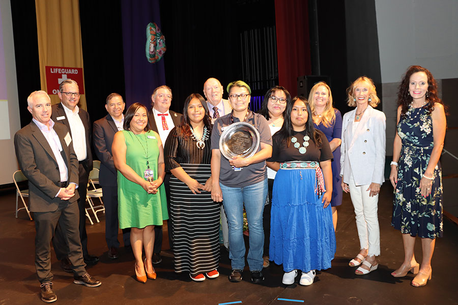 Members of the SJC Executive Cabinet stand with winner of the Fran Sandoval award at Fall 2023 Convocation.