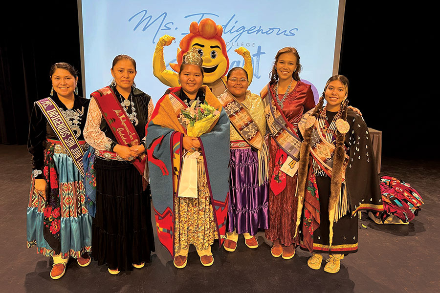 Ms. Indigenous SJC 22-23 Jaymie Begay, Lynell Pablo, Ms. Indigenous SJC 2023-24 Dalilah Tsosie, Tia Harvey, Rhianna Carel, Gabriella Mason and SJC Mascot Blaze.