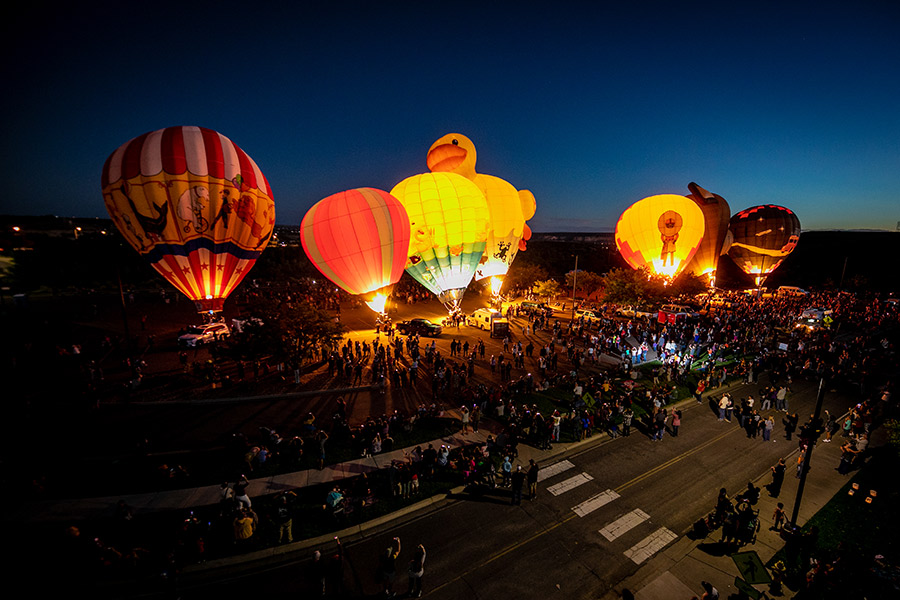 Balloons inflating in the Henderson Fine Arts Center parking lot at the 2022 Four Corners Balloon Rally.