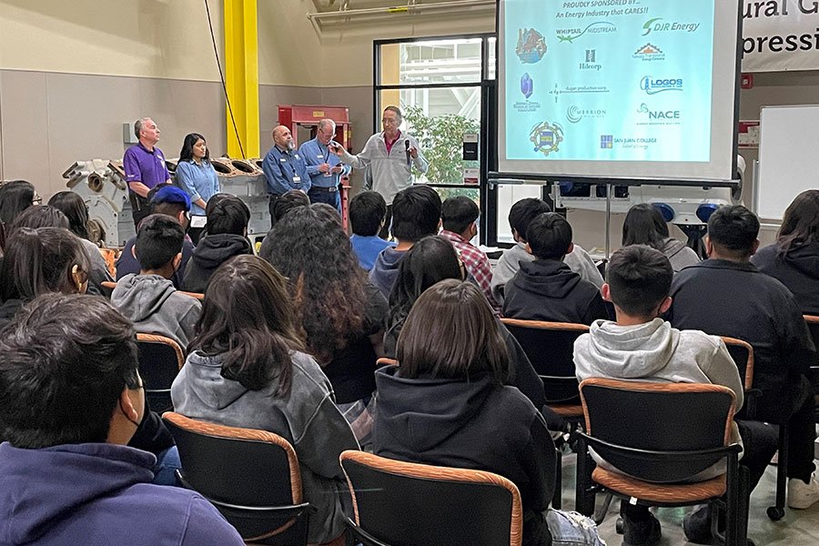 Group of students listening to George Sharpe speak on Energy.