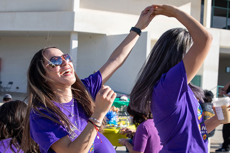 Two girls dancing at the Fiesta at Sunset