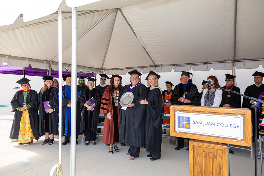 Pictured Center: SJC President Dr. Toni Hopper Pendergrass and SJC Foundation Executive Director Gayle Dean present Lori Schiess with the Allison Award at the 2024 SJC graduation ceremonies.