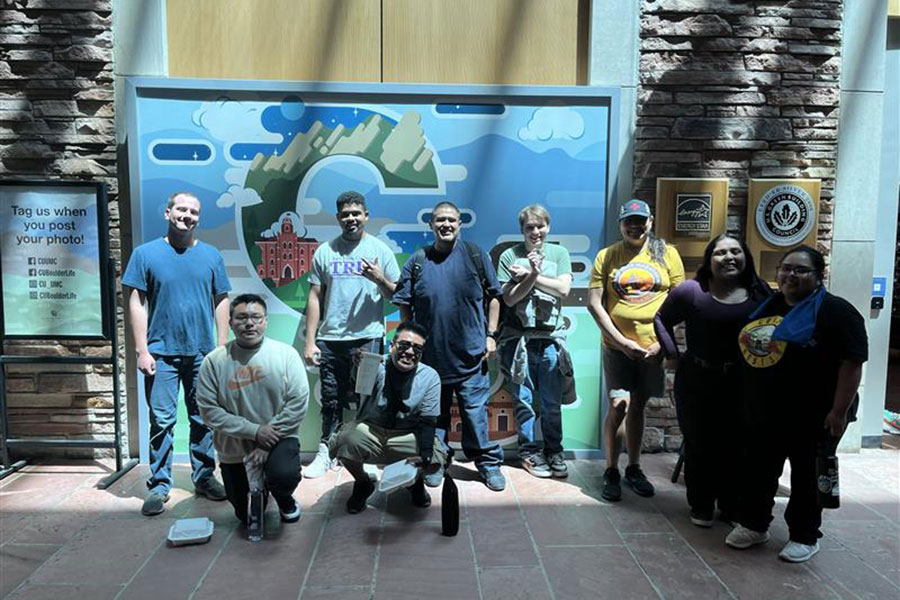 Group of TRIO students standing in front of a Colorado sign