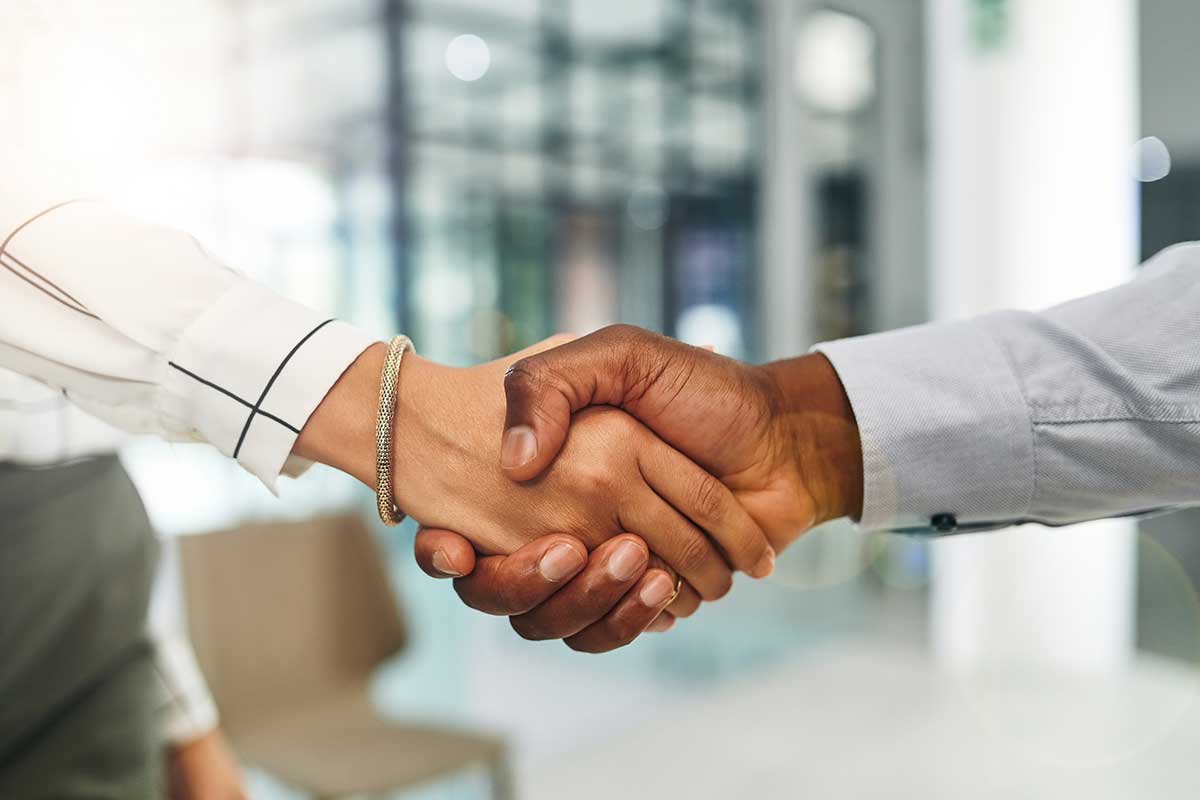 two people shaking hands.