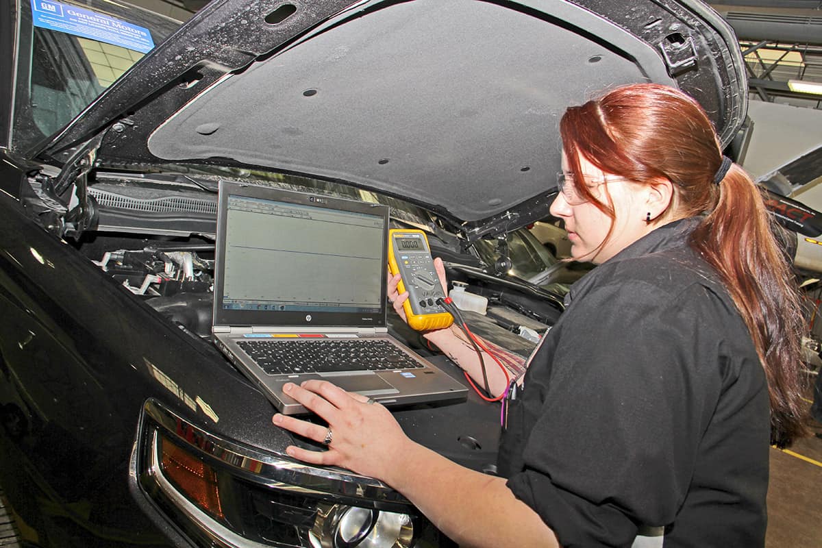 Student in the Automotive Technology Certificate Program working on a car.