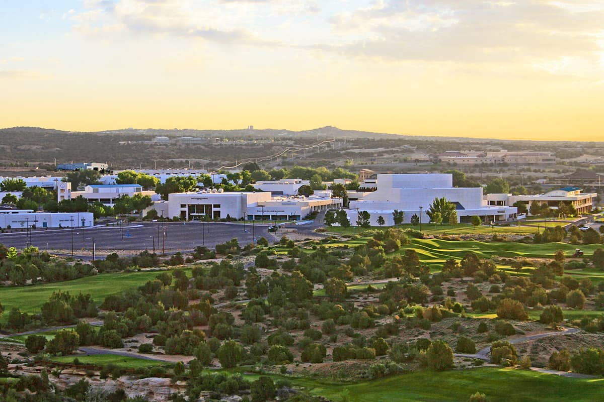 scenic view of the farmington campus with the morning sun rising behind the campus.