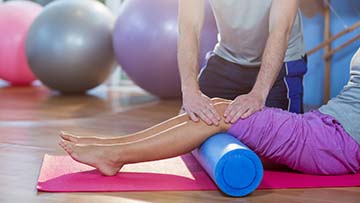 Persons legs on a roller.