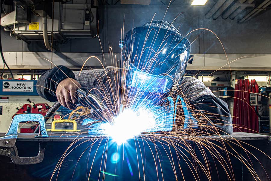 San Juan College student practicing welding