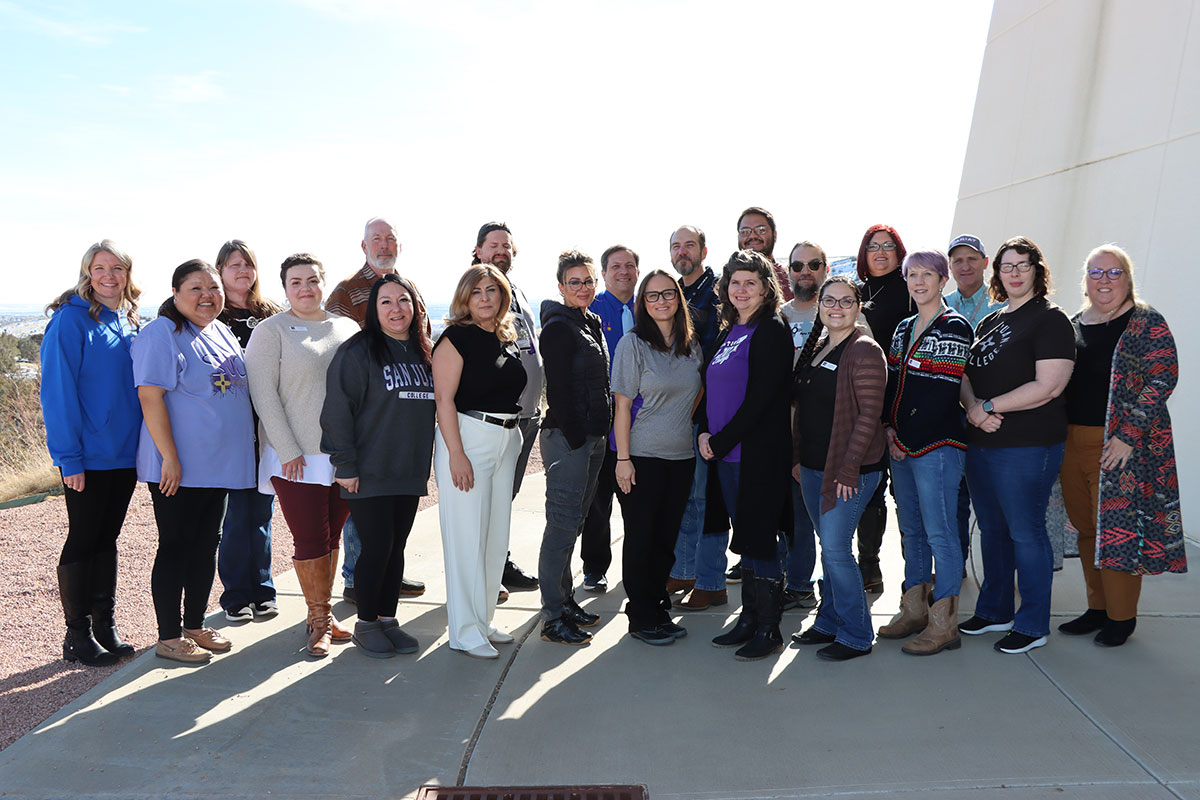 LAMI Cohort, group of individuals from San Juan College throughout various departments standing together outside.