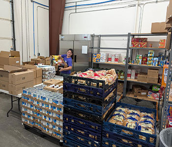 Student Resource Center at San Juan College putting together food boxes for students.